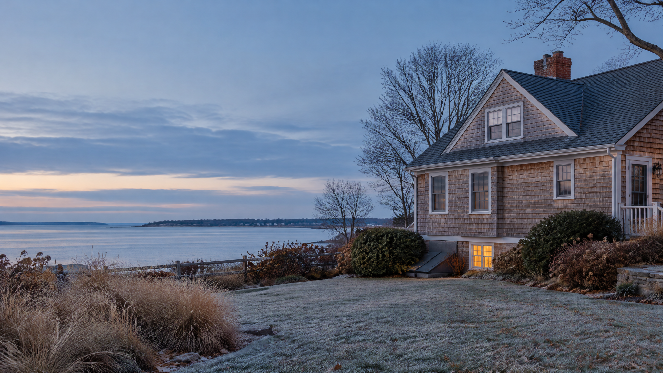 Cape Cod seasonal home prepared for winter at blue hour